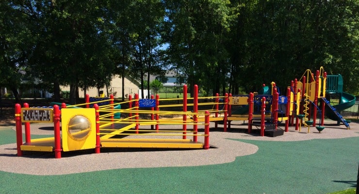 A large playground with a ramp that connects all the features.