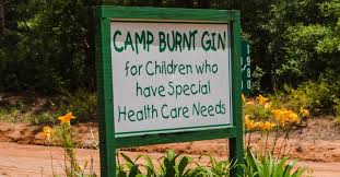 A sign that reads Camp Burnt Gin, for Children who have Special Health Care Needs.